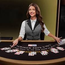 Live baccarat dealer dealing cards at api88 login studio table